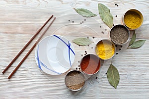 Spices on a wooden light background photo