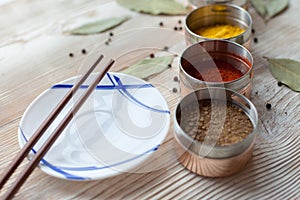 Spices on a wooden light background photo