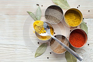 Spices on a wooden light background photo