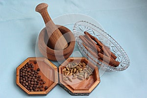 Spices and a wooden mortar for grinding them 0091 photo