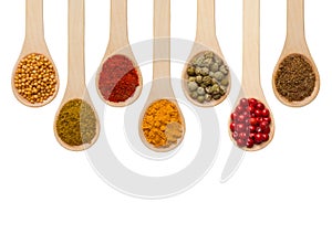 Spices in wooden spoons