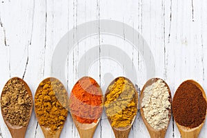Spices on Wooden Spoons photo
