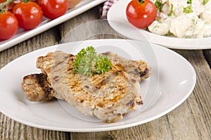 Spicey pork chop with parsley photo