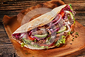 Spicy Asian doner kebab on toasted tortilla photo