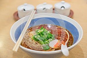 Spicy asian ramen noodle soup in bowl.