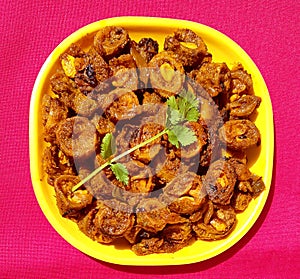 Spicy bitter gourd or Karela curry