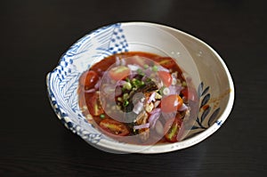 Spicy Canned Sardine Salad with hand, Thai fast food