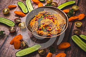 Spicy carrot hummus with raw vegetable sticks