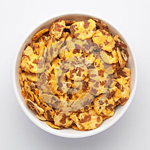 Spicy Chana Jor Garam on a white Ceramic bowl, made with air-fried Bengal Chickpea. Pile of Indian spicy snacks Namkeen,