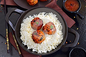 Spicy chicken balls in sweet chilli glaze with rice