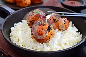 Spicy chicken balls in sweet chilli glaze with rice