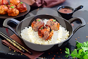 Spicy chicken balls in sweet chilly glazur with rice