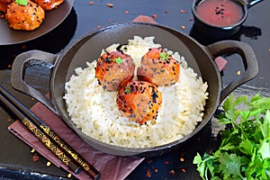 Spicy chicken balls in sweet chilly glazur with rice