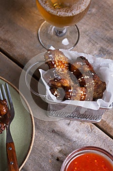 Spicy chicken chicken wings prepared on barbecue.