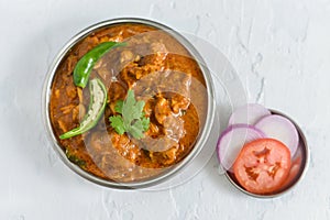 Spicy chicken curry masala, with roti popular Indian dish