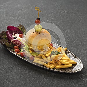 Spicy CHICKEN mexicano burger with french fries served in dish isolated on table top view of fastfood photo