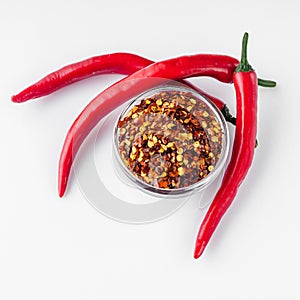 Spicy chili flakes on a white background