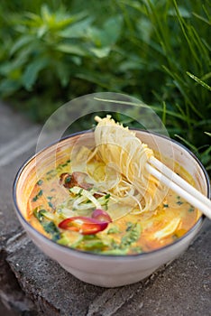 Spicy Coconut Noodle Soup with Fish, Egg and Vegetables. Laksa, Local Malaysian Dish
