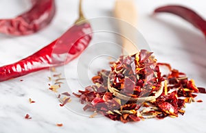 Spicy cutted Chili peper mix on stone background, close up shot