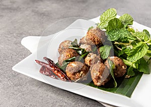 Spicy deep fried pork larb , Laab Moo Tod , Thai style recipe