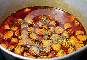 Spicy Dum Aloo In A Large Container