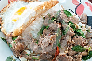 Spicy fried beef and basil leave with fried egg