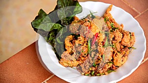 Spicy fried chicken salad in the dish .delicious of Thai food