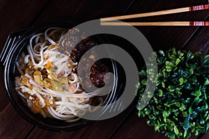 Spicy fried pork spareribs with thick rice noodles soup