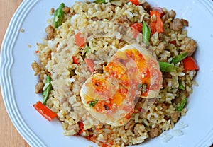 Spicy fried rice with minced pork and basil leaf topping sweet egg