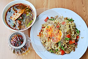 Spicy fried rice with minced pork topping sweet egg and soup