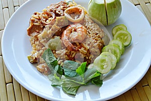 Spicy fried rice prawn and pork with eggplant in shrimp paste sauce on plate