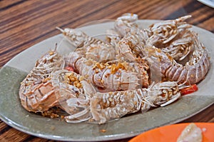 Spicy garlic dried stir fried mantis rock lobster with sea salt in Hong Kong cuisine style