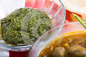 Spicy green chutney, indian dish concept