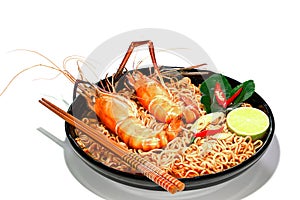 Spicy instant noodles soup with rivers shrimp on top, isolated on white background. Tom Yum Kung name in Thailand Foods Style