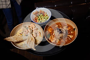 Spicy japanese miso tofu ramen with kimchi on restaurant table.