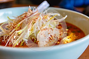 Spicy Japanese ramen noodle soup with egg, Japanese food culture, close up image