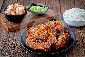 Spicy korean fried chicken with pickled radish and rice