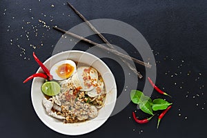Spicy lemongrass soup noodle with Soft-boiled eggs top view