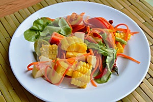 Spicy mixed fruit and vegetable salad on dish