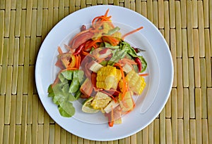Spicy mixed fruit and vegetable salad on dish