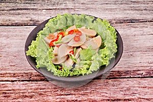 Spicy mixed vegetable salad with sliced Thai white pork sausage