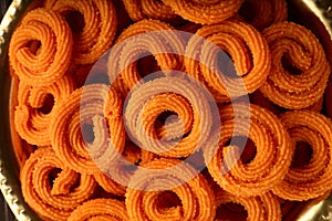 Spicy  murukku or chakli. served in brass plate.