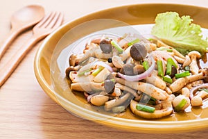 Spicy mushroom salad on plate, Thai food