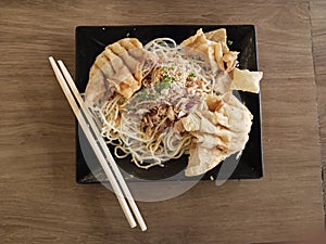 Spicy Noodles with Dumplings