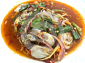 Spicy oyster salad with lemon grass and herbs.Thai cuisine top view
