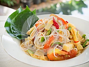 Spicy papaya salad with rice noodle or somtum famous traditiona
