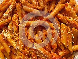 Spicy Pasta Arrabiata Topped With Parmesan Cheese