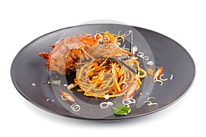 Spicy Pasta with seafood with herbs and spices in Black dish iso