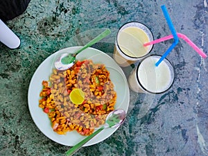 Spicy peanuts served with lassi