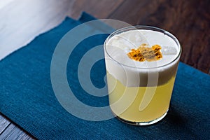 Spicy Pisco Sour Cocktail made with Lime juice, Egg White and Peruvian Grape Schnaps.